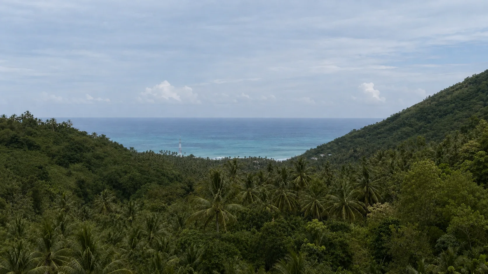 Ocean view across the jungle valley from the Konekt Plots land, Kuta South Lombok